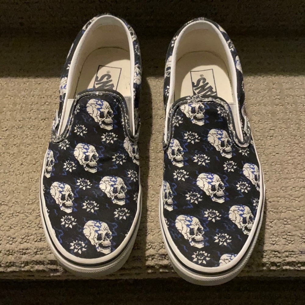 Vans with skulls and flowers, blue lines on black shoe. Size 7.5 women’s/men’s 6